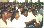 Youths listening to award ceremony